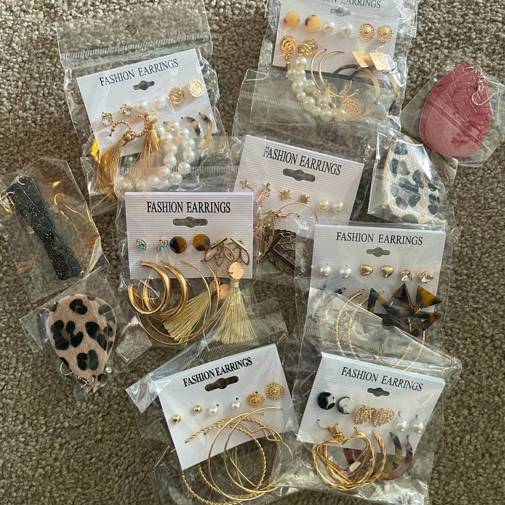 Bundle of earrings. Never opened. Over 40 pairs in all